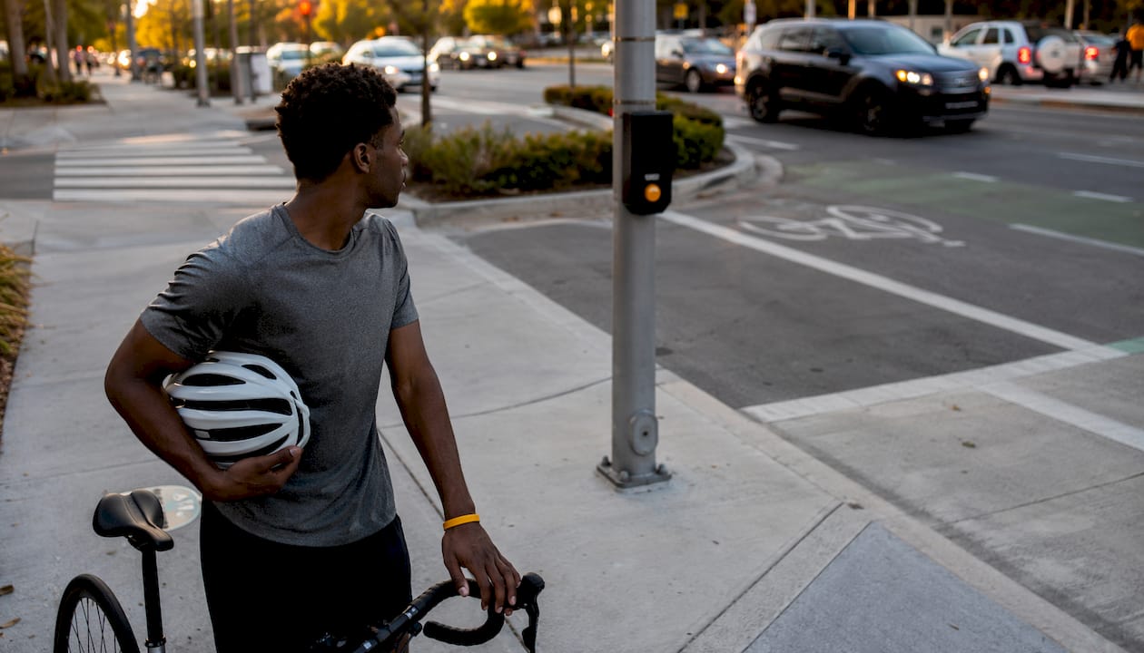 Young cyclist checking traffic at intersection