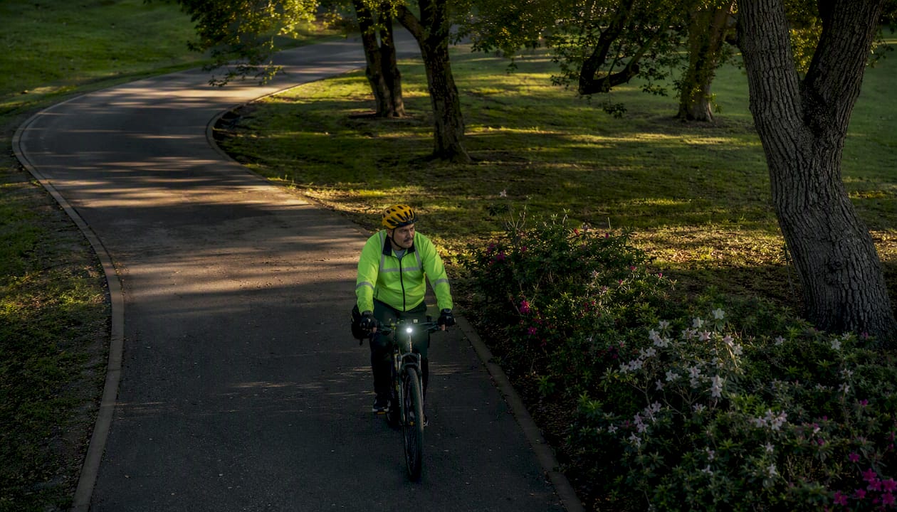 Cyclist riding with safety helmet and lights