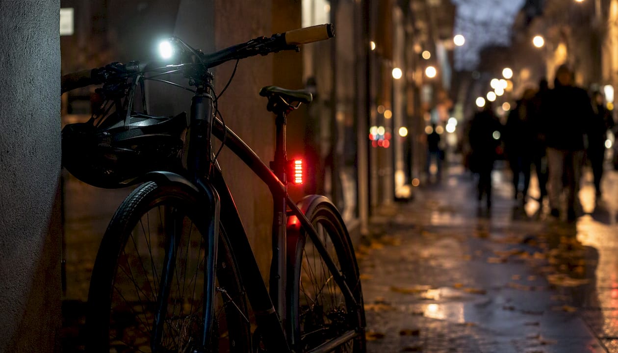 Bicycle lights glowing at dusk