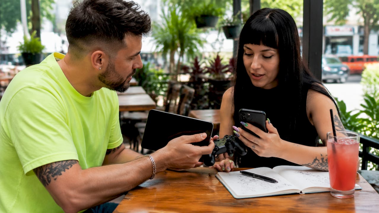 Hands comparing device prices to maximize skin trade value