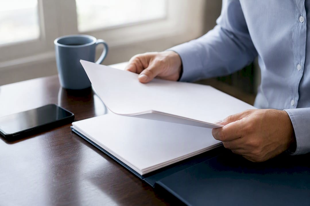 Hands organizing business finance documents
