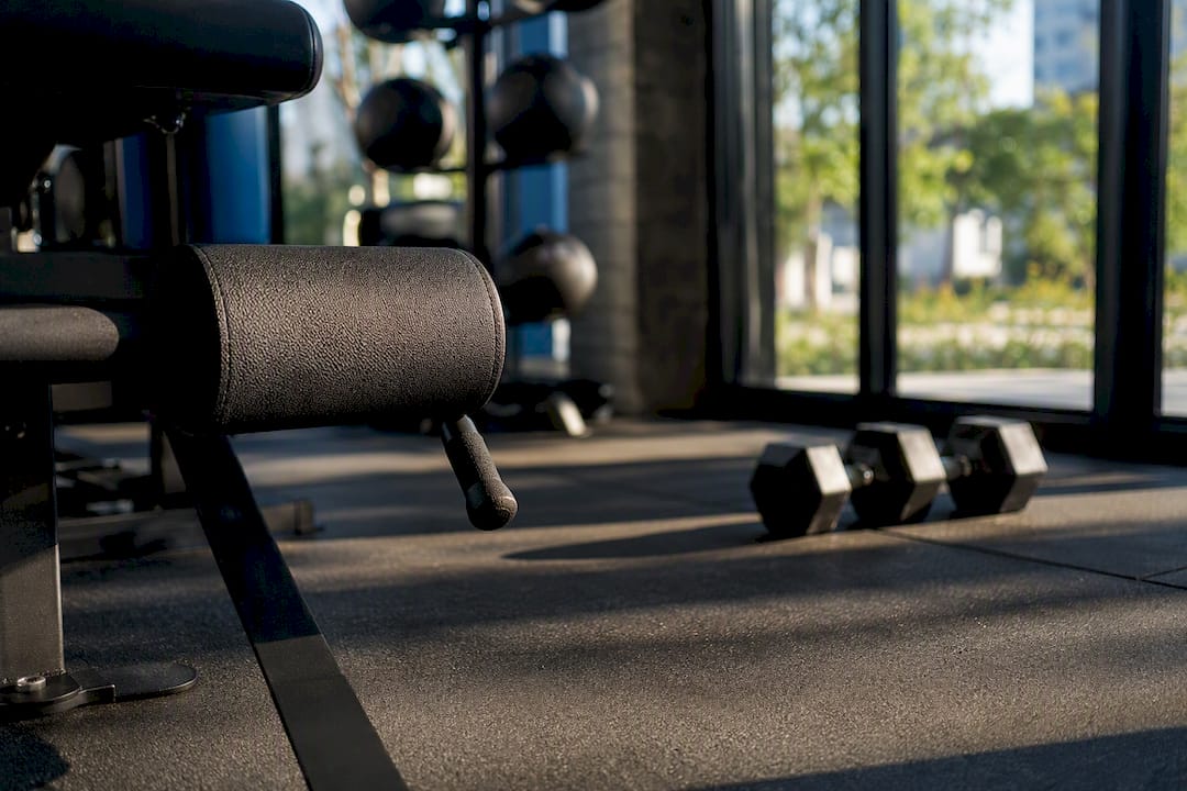 Close-up of gym equipment handles and flooring