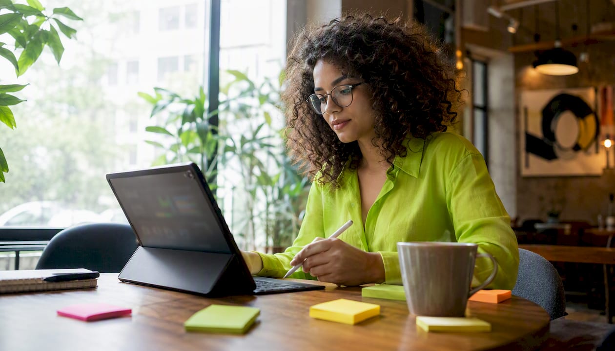 Marketer using VWO dashboard on tablet
