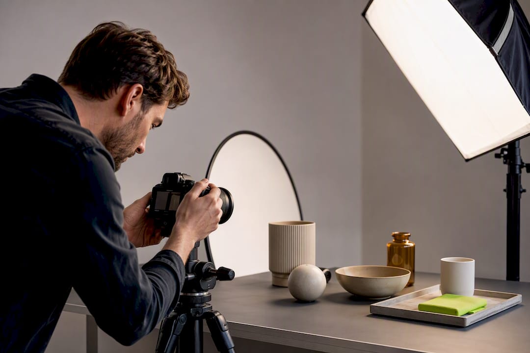 Photographer styling anonymous catalogue products