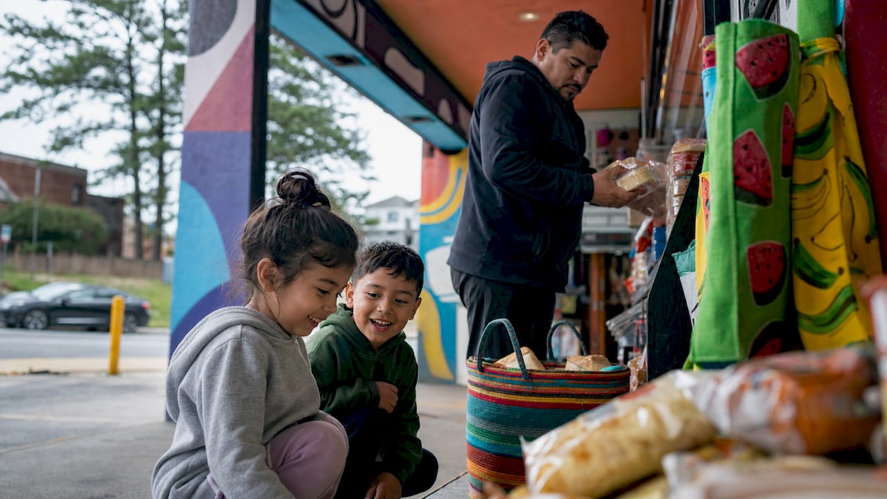 Father shopping breakfast with children at store