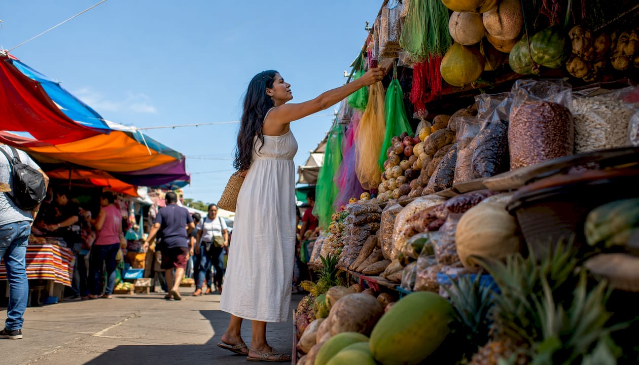 Shopper selecting Caribbean groceries in ethnic market