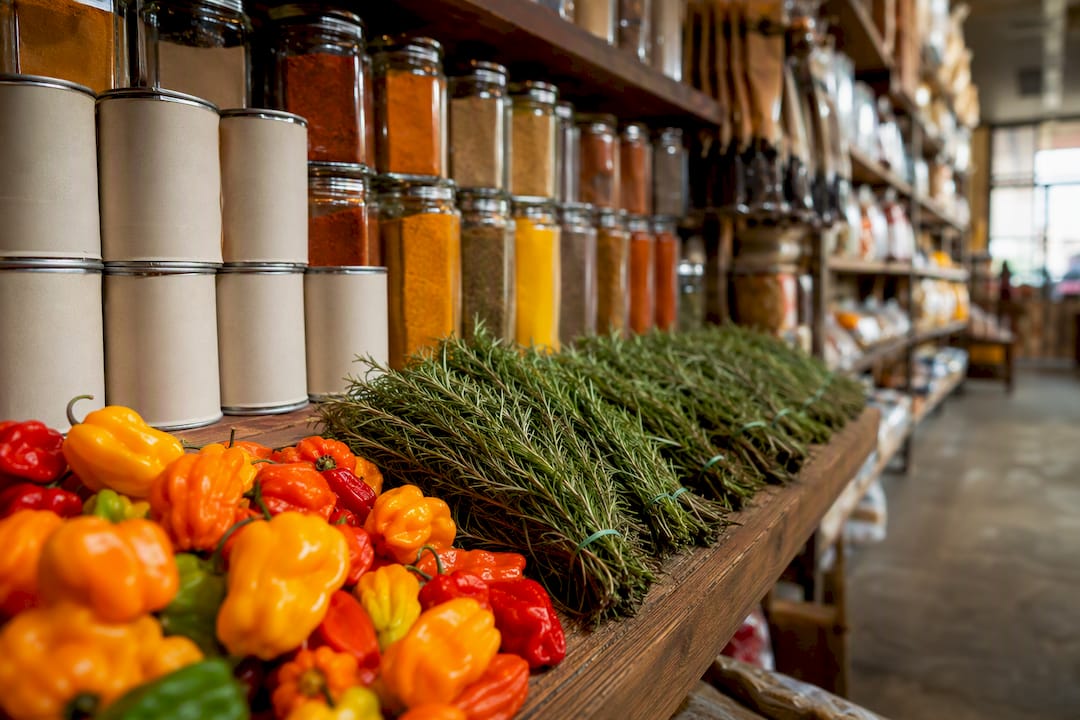 Shelf of Caribbean spices and coconut milk