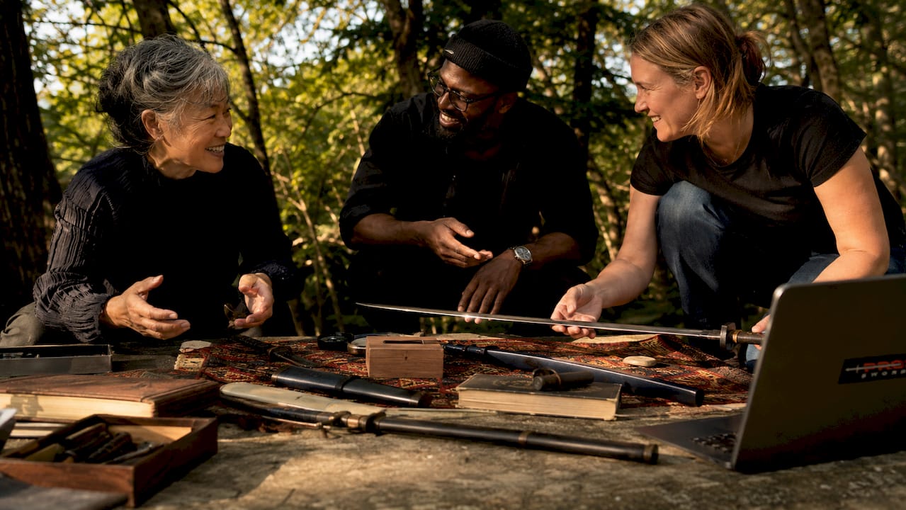 Collectors examining antique Japanese swords