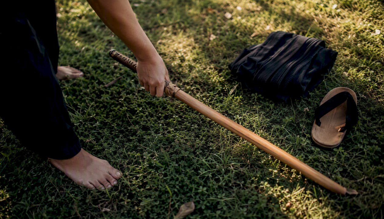 Wooden bokken sword resting in dojo