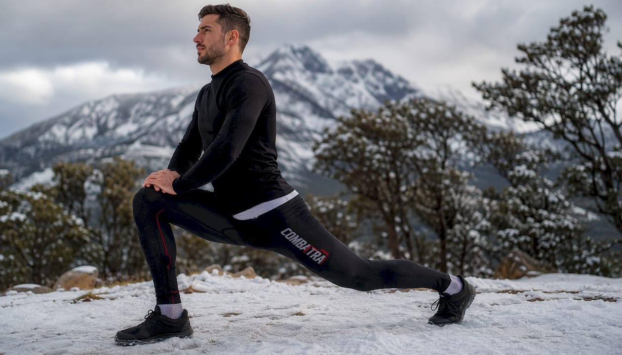 Athlete training in Combatra compression pants indoors