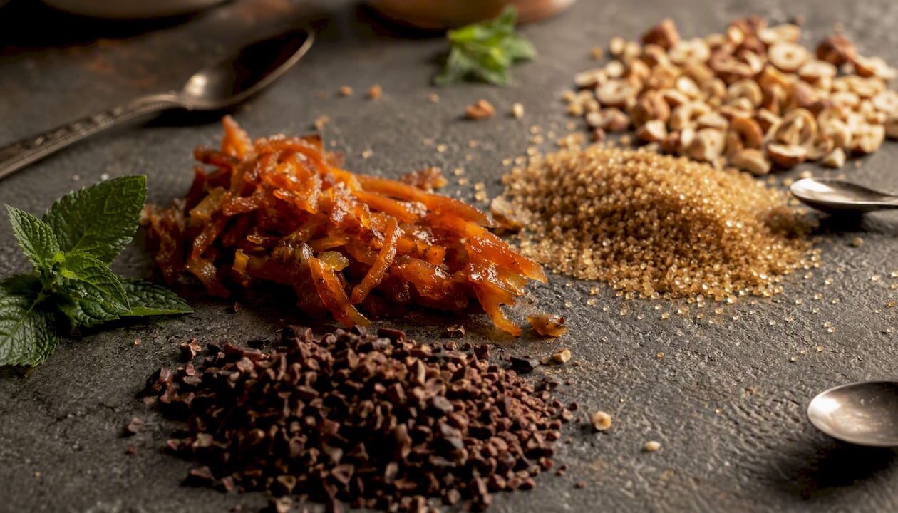 Raw gourmand fragrance ingredients on wood