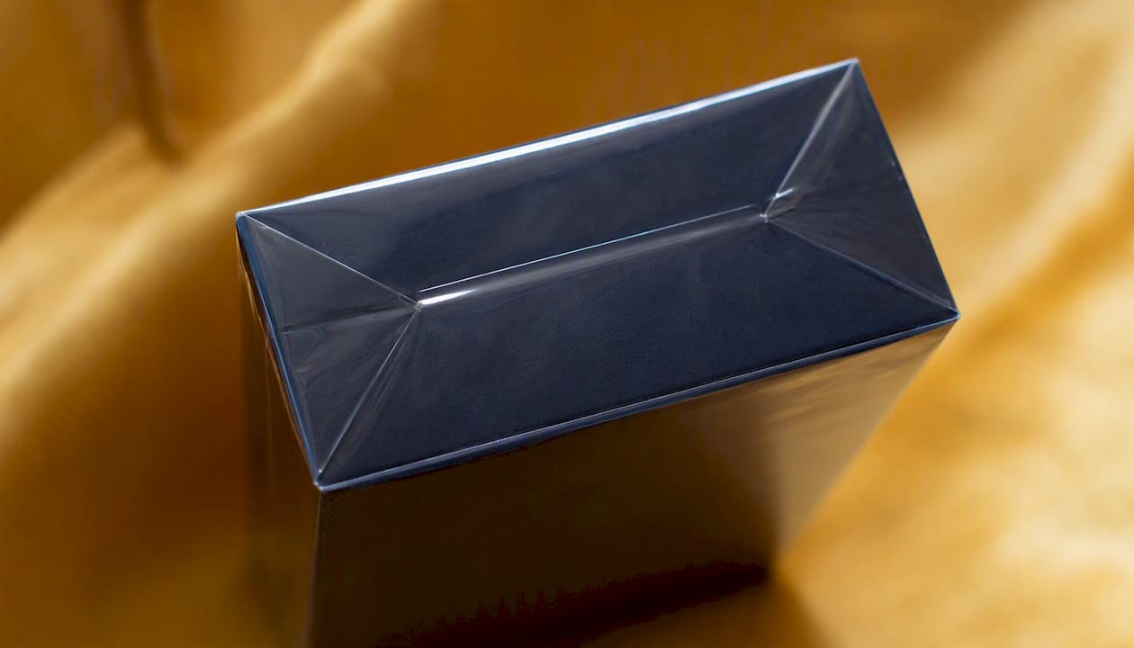 Heat-sealed cellophane wrapping on perfume box corner