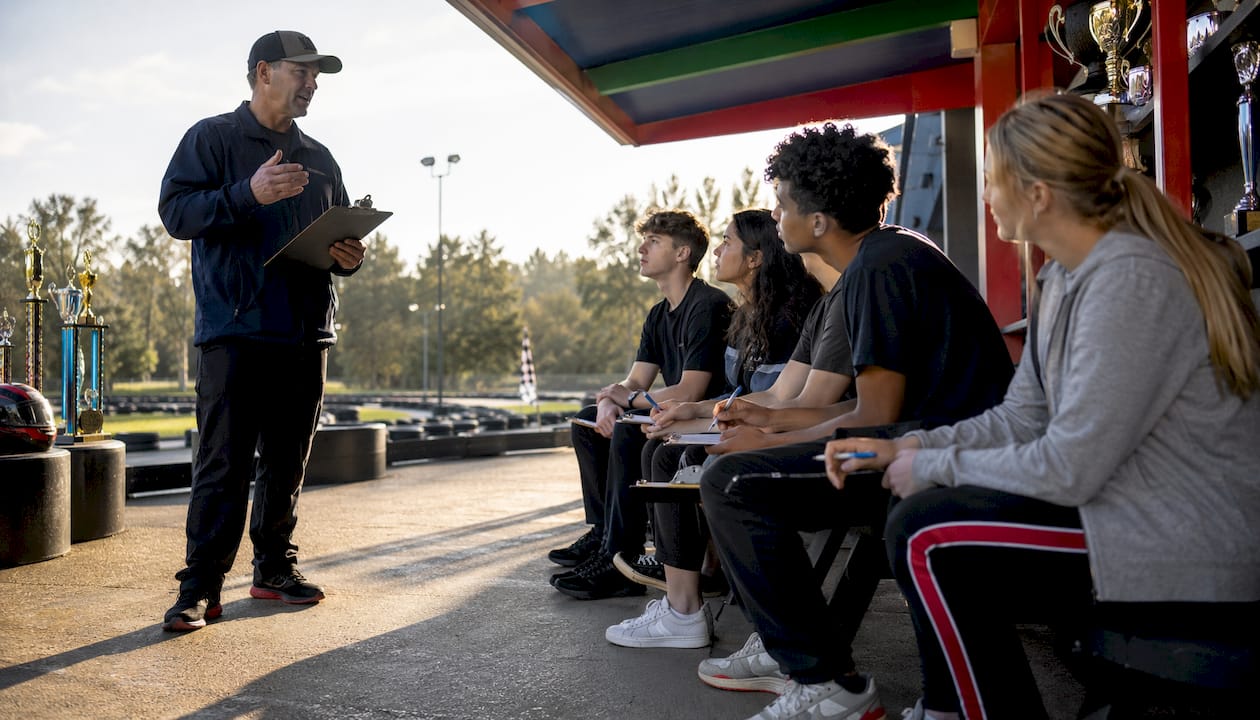 Instructor briefing students in go-kart class