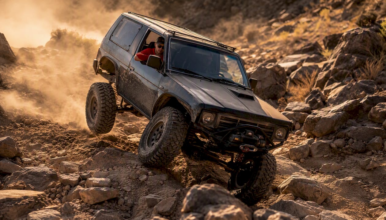 Off-road vehicle suspension flexing on trail