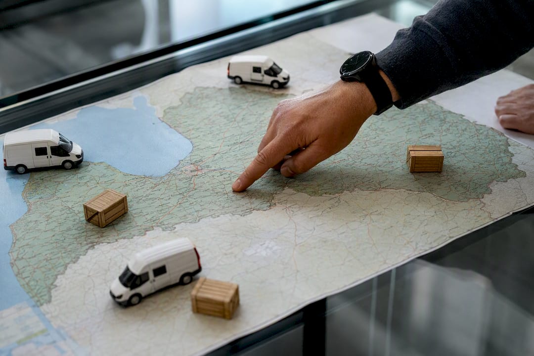 Hand pointing at Latvia delivery zone map