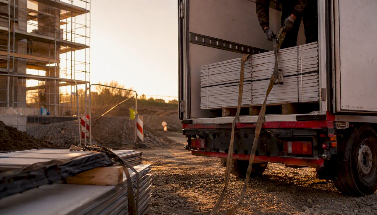 Unloading building materials at construction site