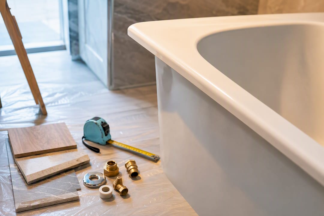 Cropped bathtub edge during bathroom renovation