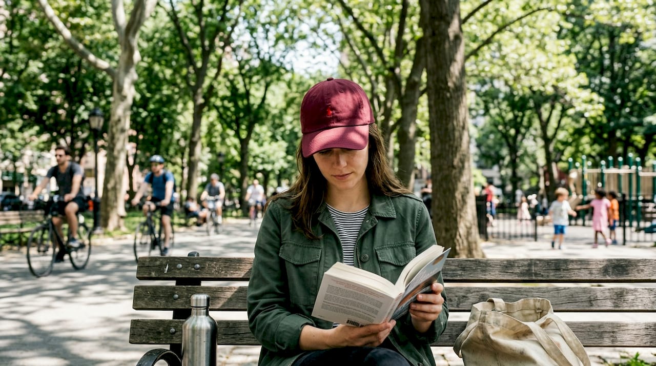 Person wearing premium cap in sunny park