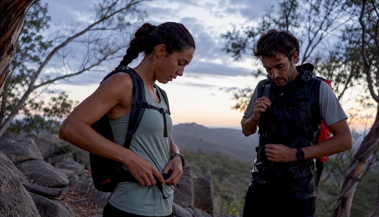Hikers wearing moisture-wicking and waterproof clothing outdoors