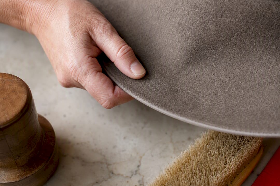 Hand testing felt hat brim texture