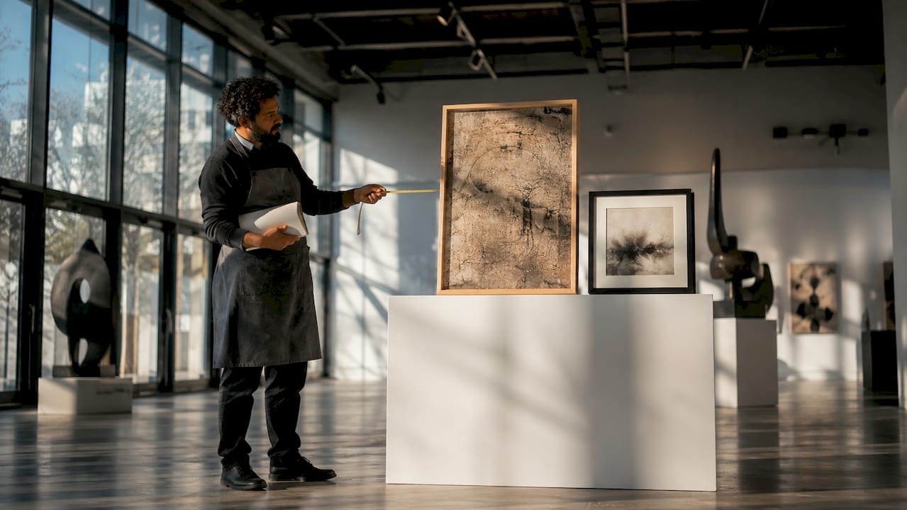 Artist comparing standard and custom artwork sizes