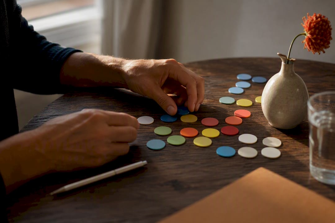 Hands adjusting measurement tokens on a table