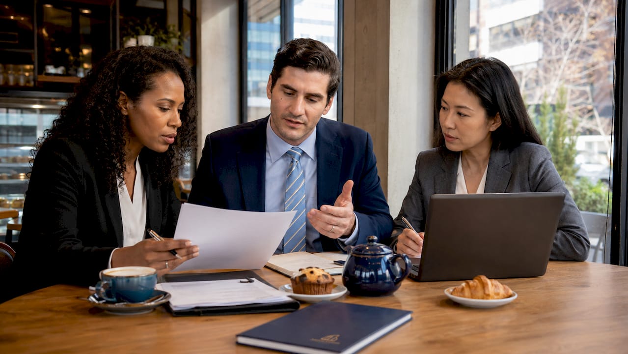 Diverse employees discussing discrimination policy