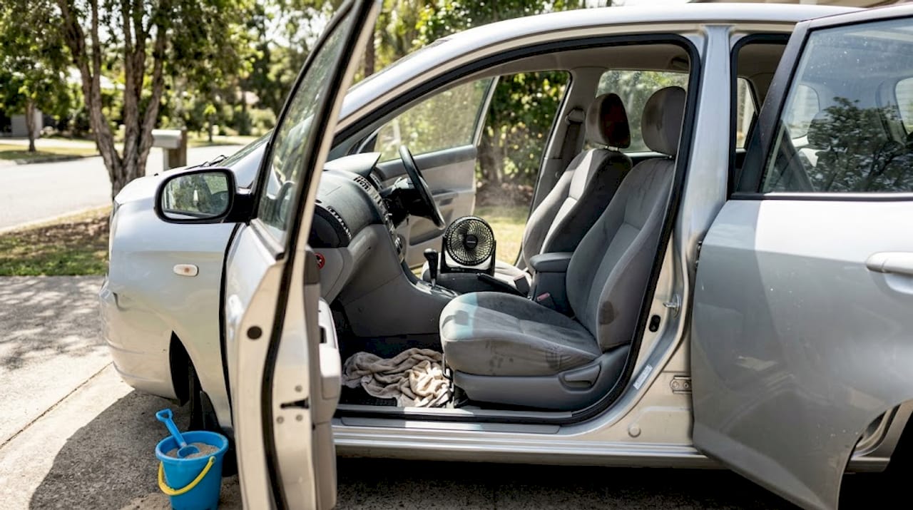 Car seats air drying with fan and sunlight