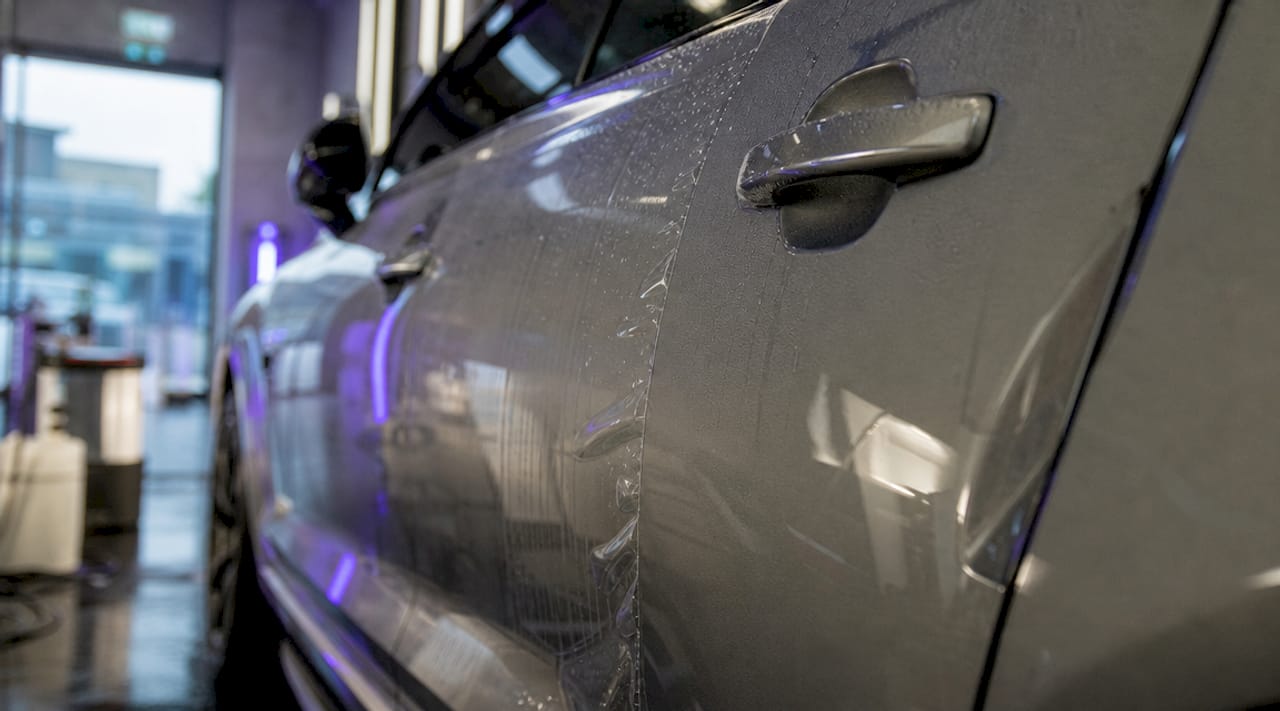Close-up of paint protection film on car door
