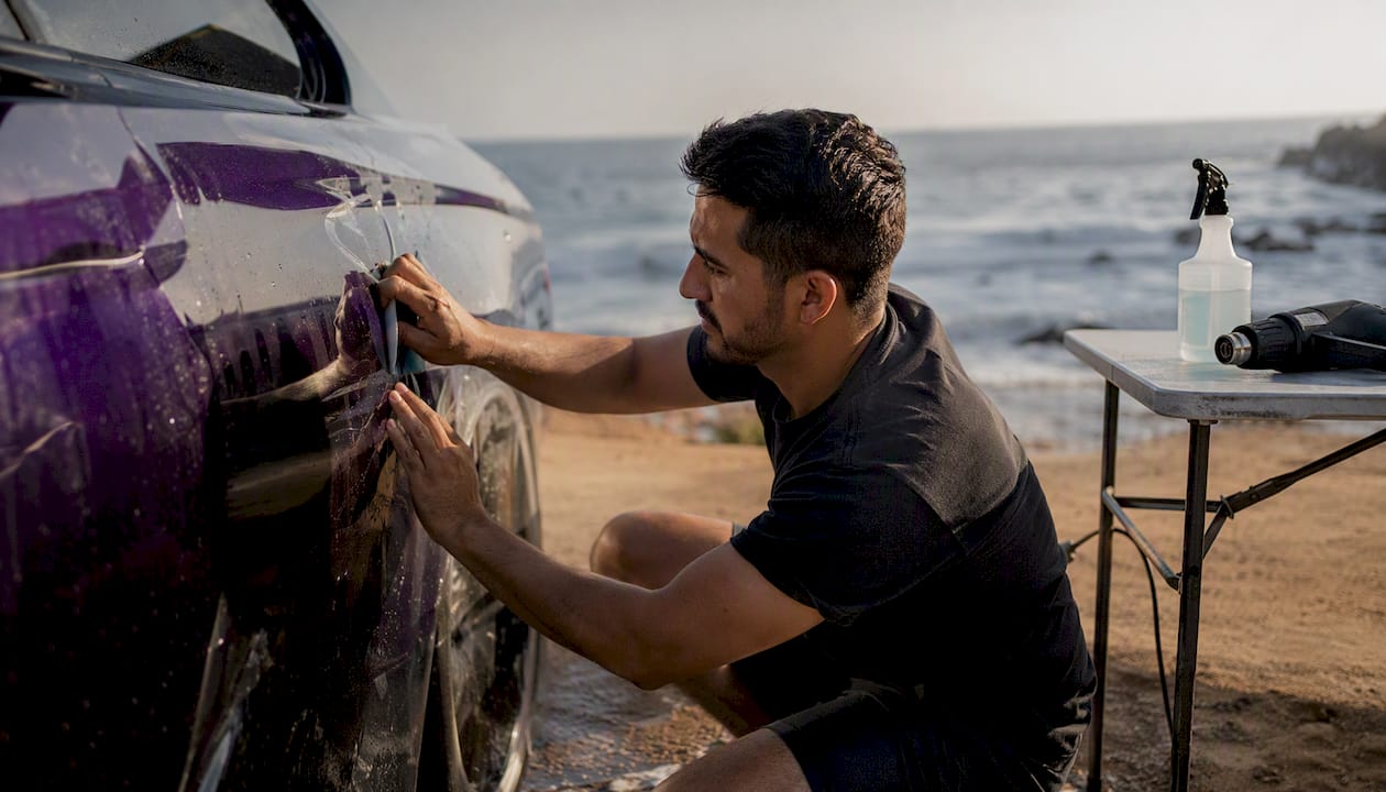 Applying paint protection film on car fender