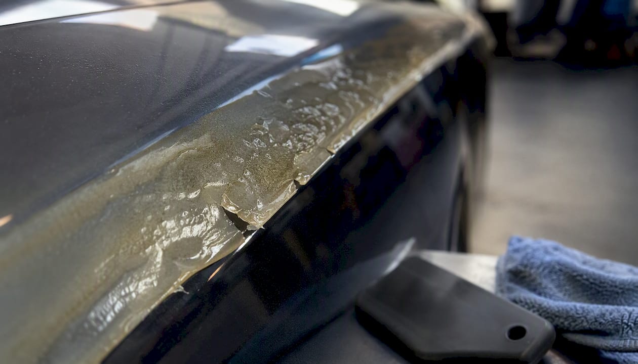Close-up of damaged paint protection film defects