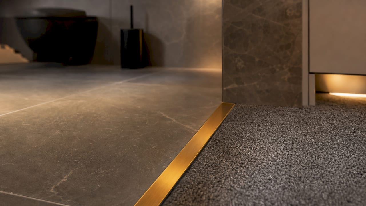 Close-up of durable solid brass edge trim at flooring transition