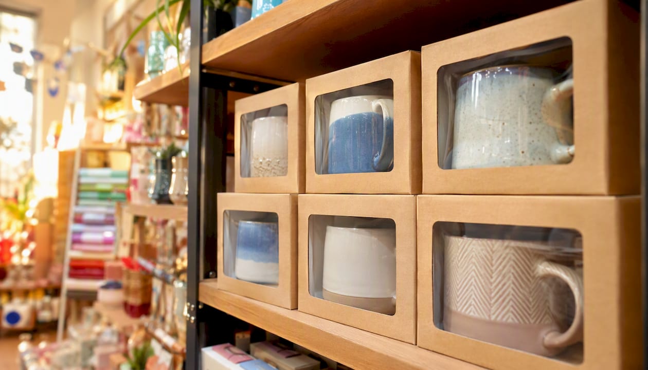 Presentation mug boxes with acetate window on retail shelf