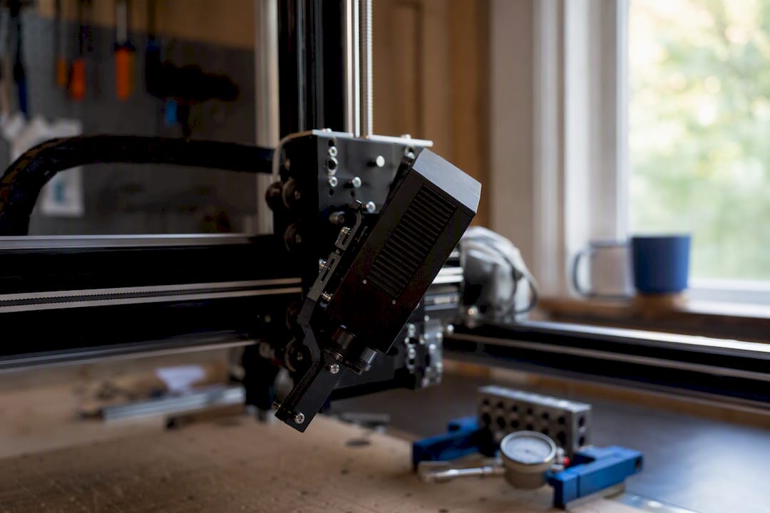 Close-up of angled camera mount on laser engraving bed