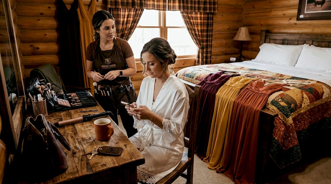 Bride prepping for wedding with makeup artist