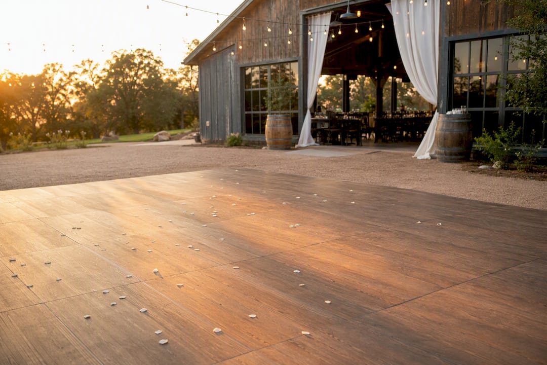 Wood-look dance floor panels inside rustic barn