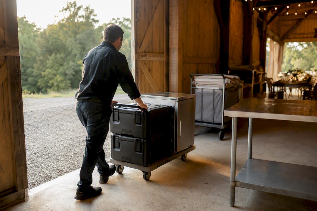 Catering equipment entering a barn staging area