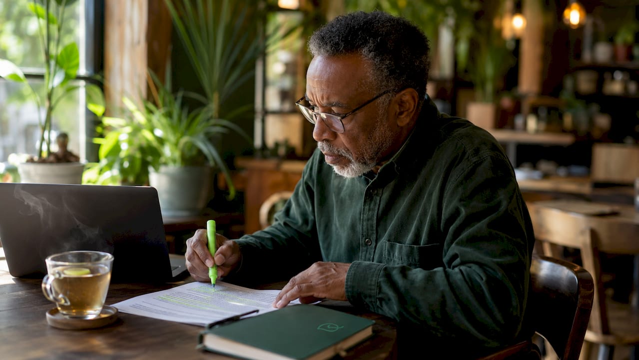 Senior man studying alternative health credential glossary