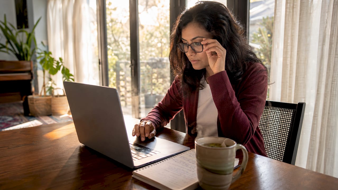 Woman setting up conversion tracking at desk