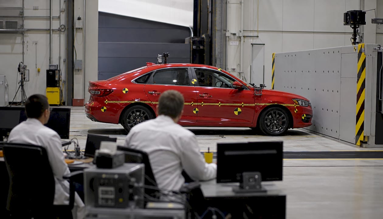 Sedan staged for frontal crash test in lab
