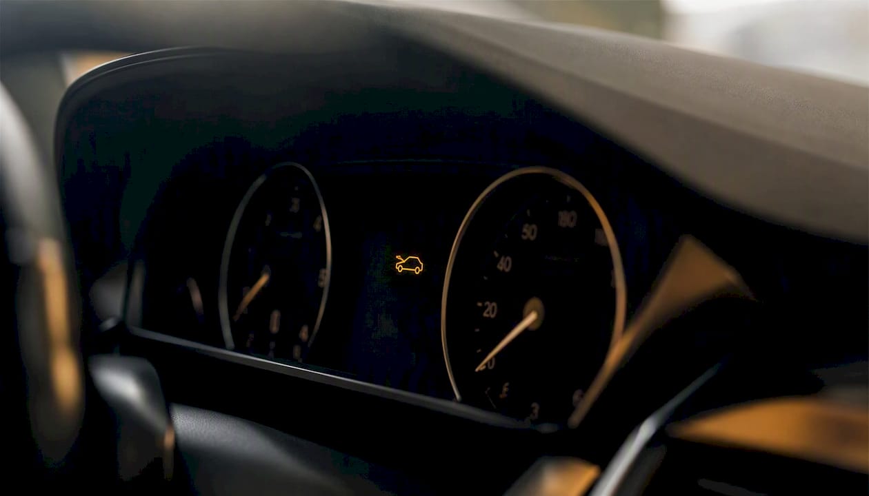 Car dashboard warning indicator light close-up