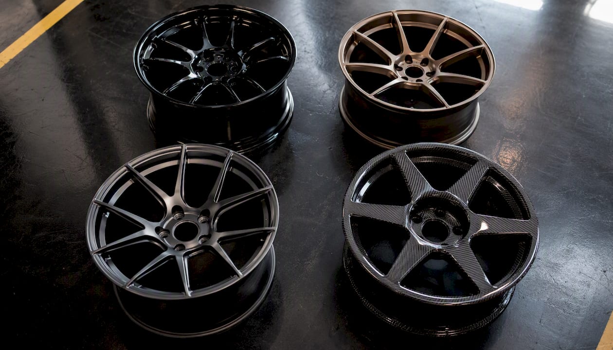 Four anonymous wheels showing different materials