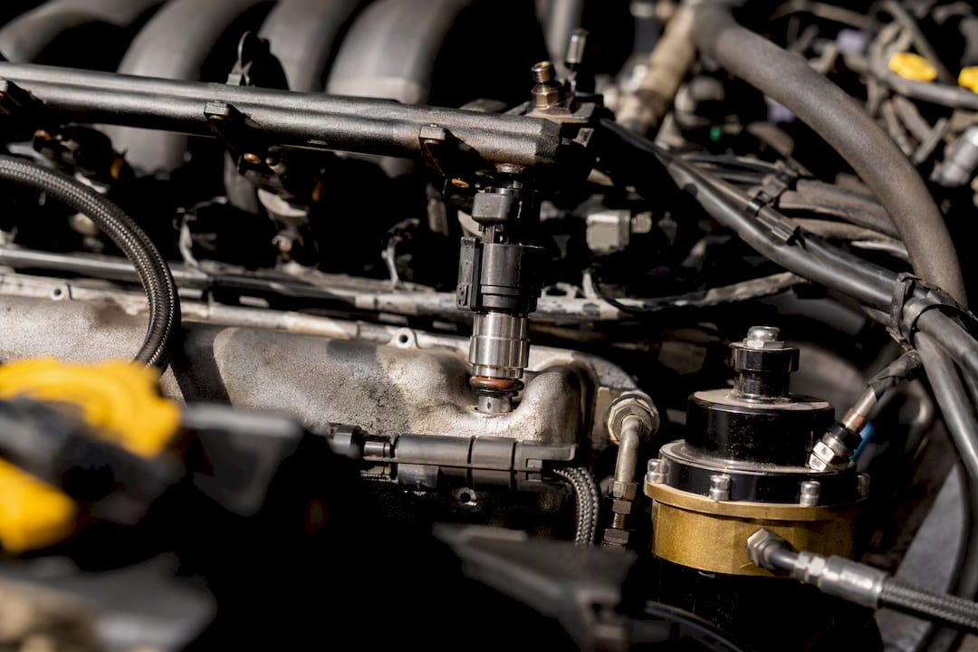 Close-up of fuel injector and pump in car engine