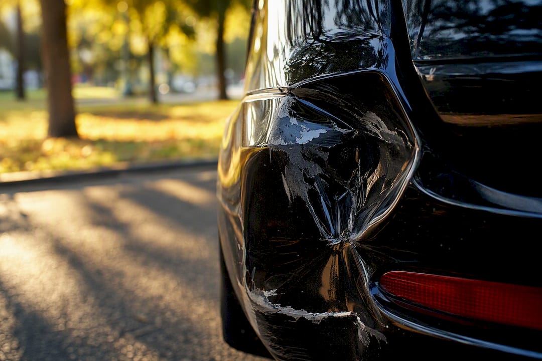 Close-up of damaged car rear bumper