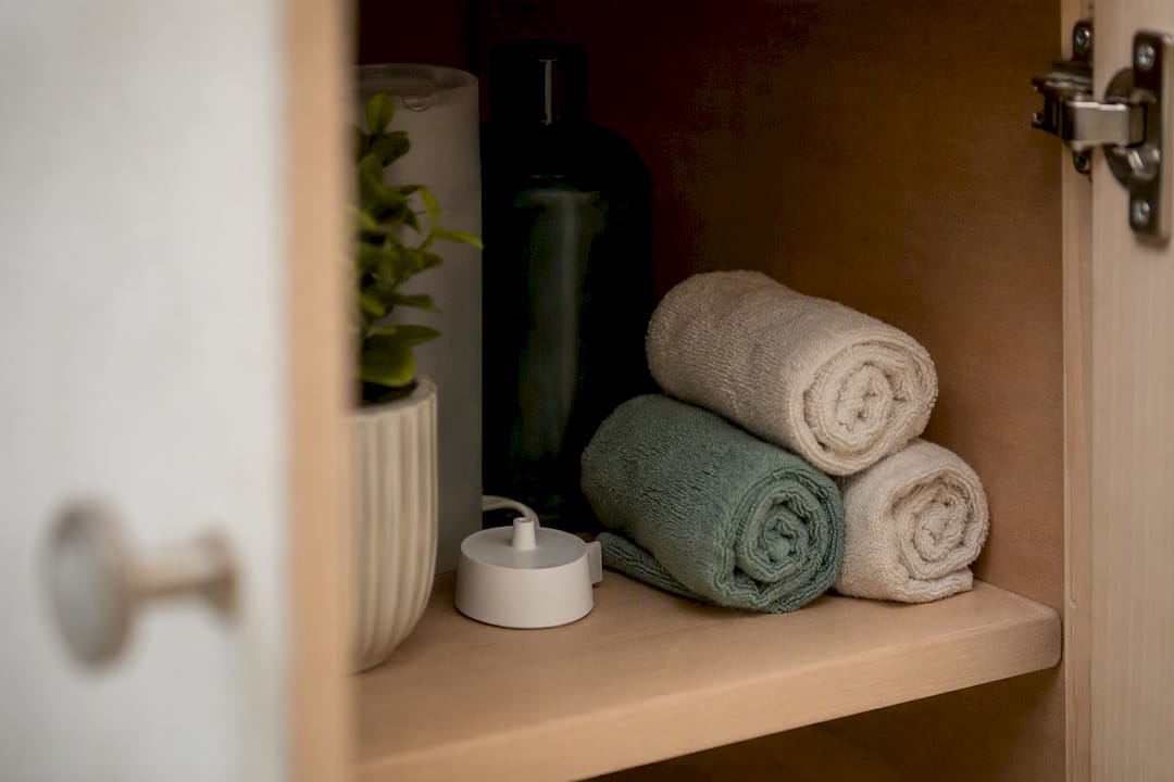 Electric toothbrush charger stored safely in bathroom cabinet