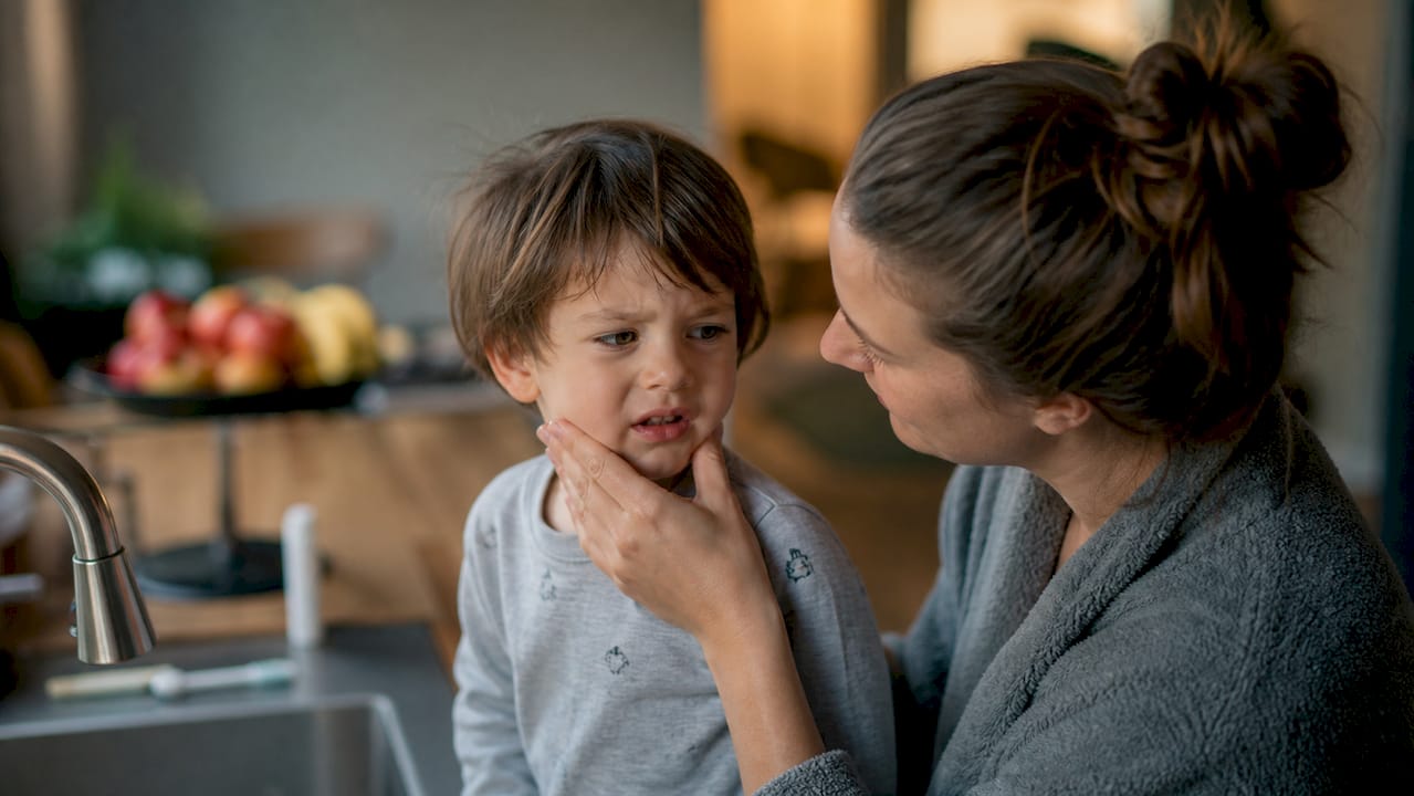 Parent soothing toddler gag reflex during brushing