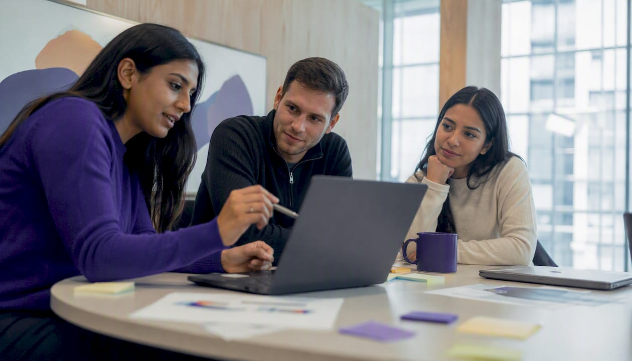Finance team collaborating with technology in meeting room