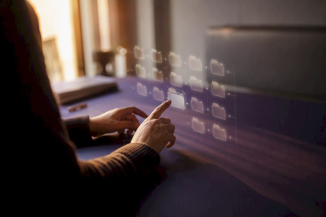 Hands organizing digital files concept