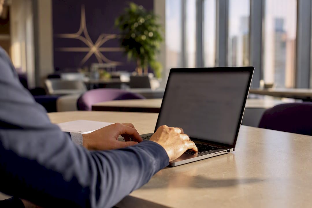 Hands scanning invoice from email on phone