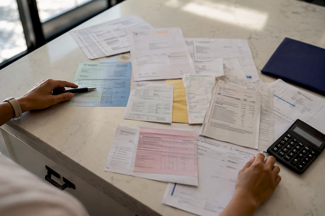 Blurred international invoices on desk